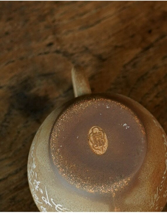 This is a pottery teapot