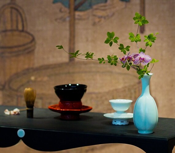 This is a celadon ceramic vase flower arrangement vessel