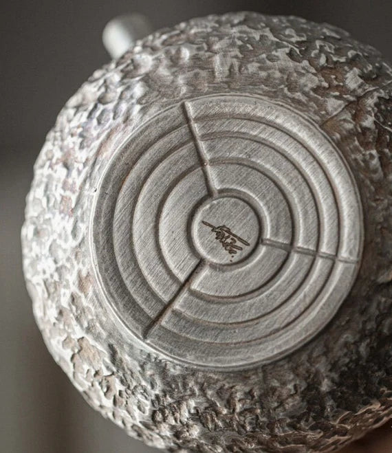 This is a gilted silver kettle