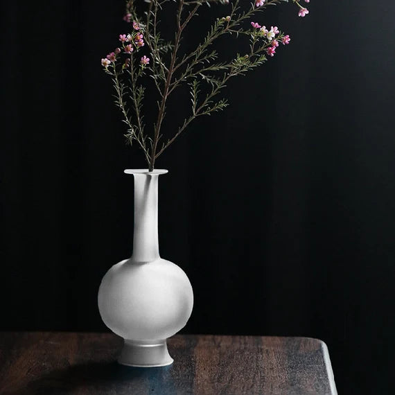 This is a blue glass vase flower arrangement vessel
