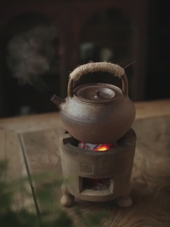 This is a pottery lifting handle kettle