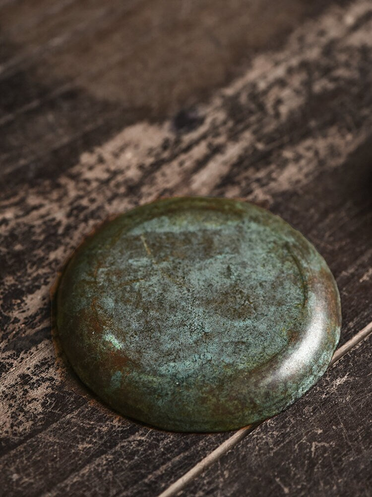 this is a copper teacup tray