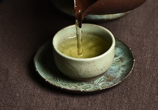 this is a copper teacup tray