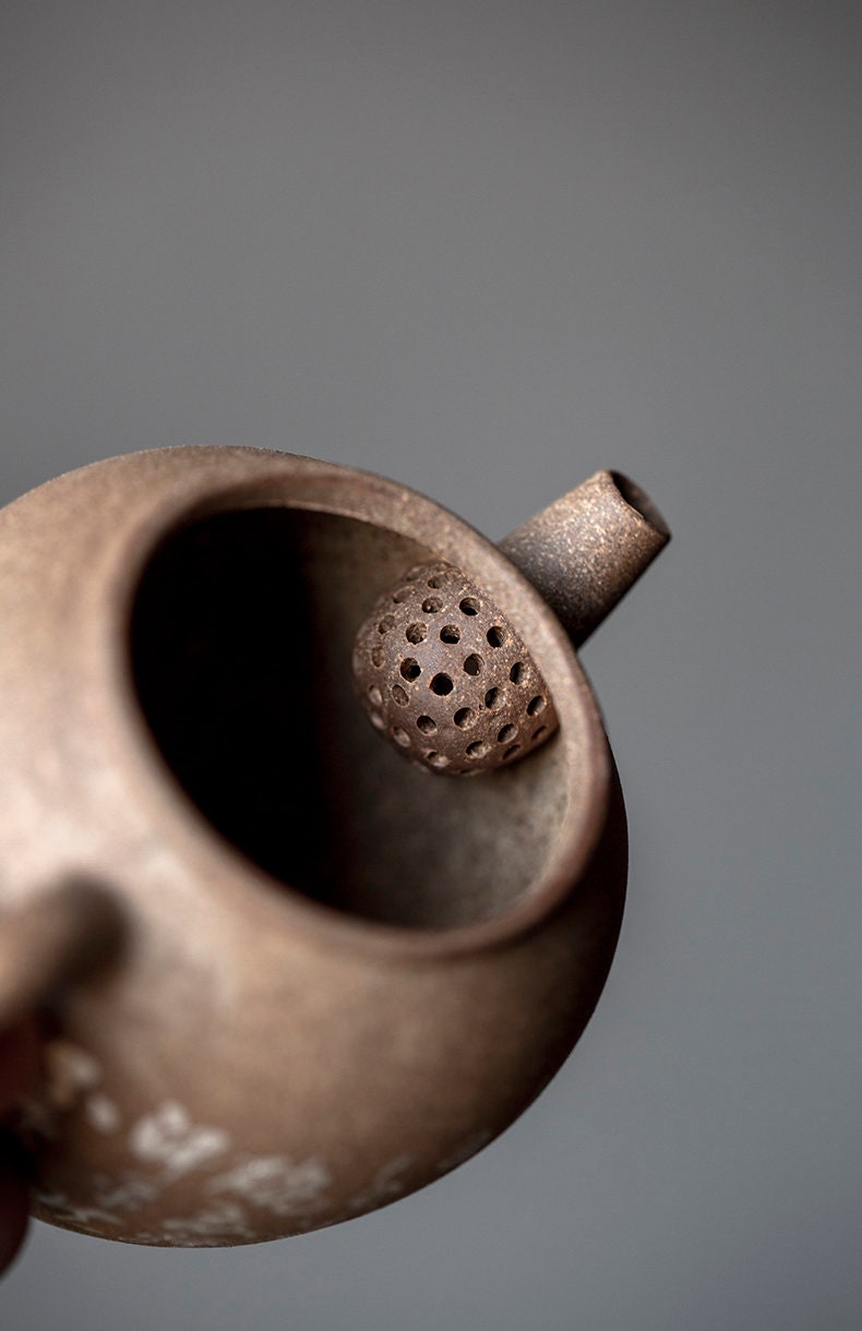 This is a pottery teapot