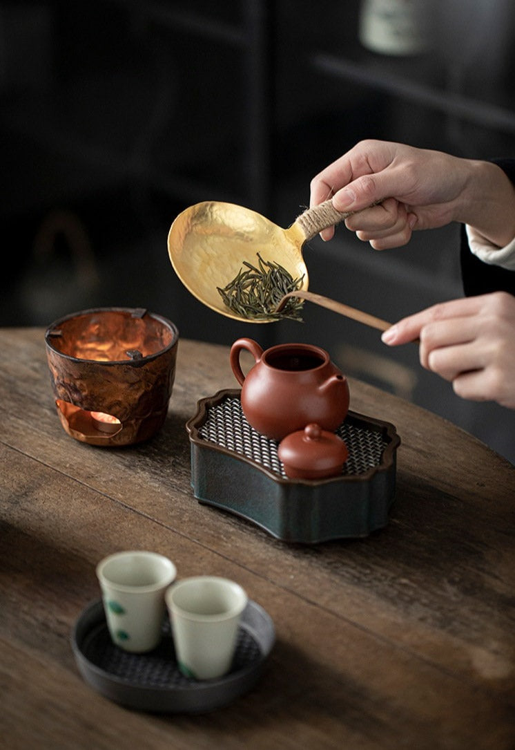 This is a mini copper scoop stove set