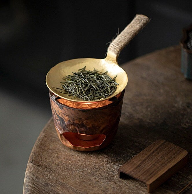 This is a mini copper scoop stove set