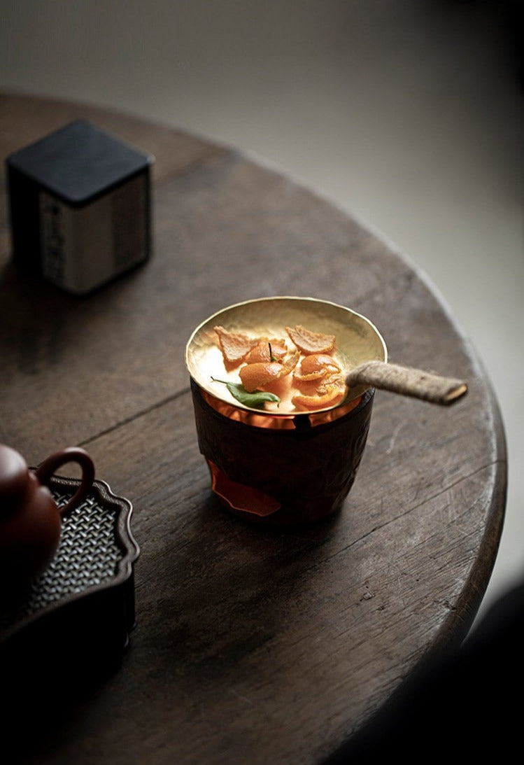 This is a mini copper scoop stove set