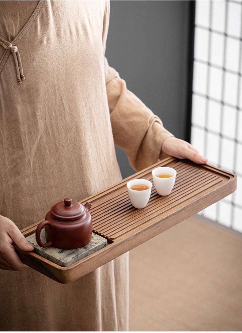 this is a walnut tea tray tea boat