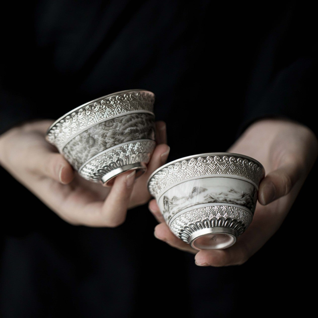 This is a gilted silver ceramic teacup