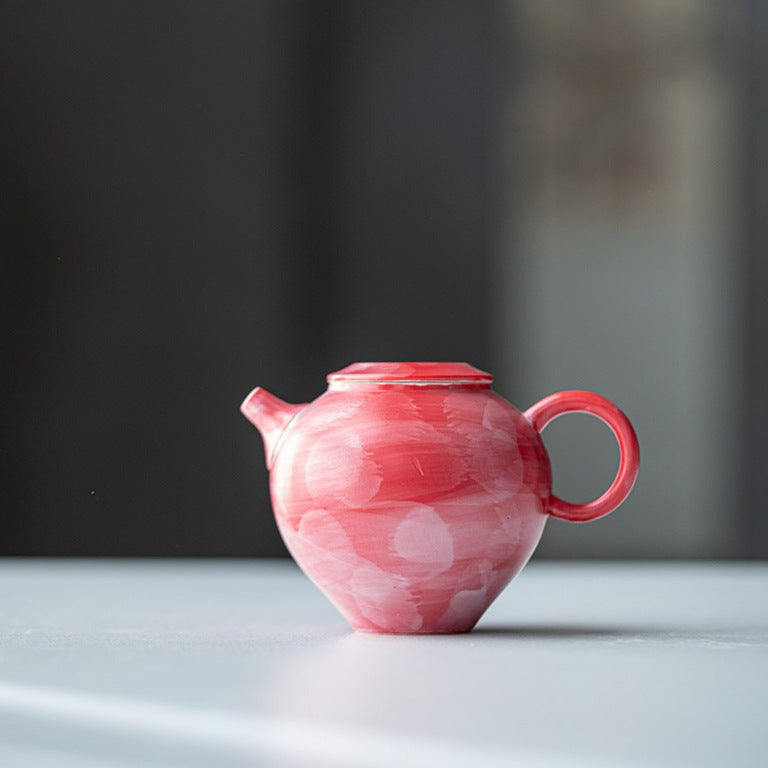 This is a ceramic teapot