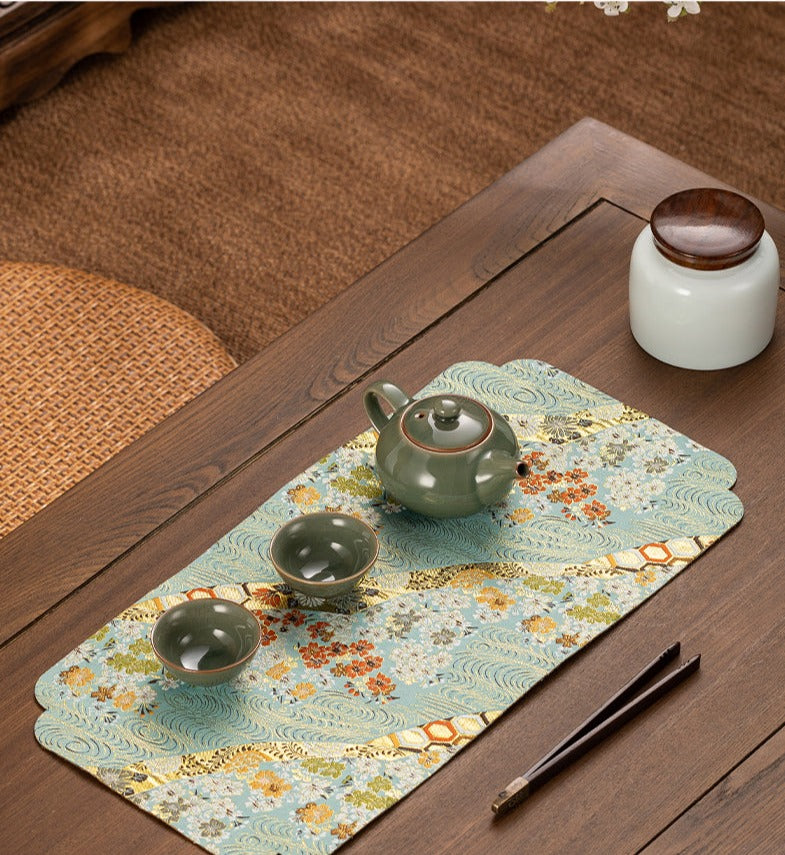 This is a silk brocade tea mat.this is a waterproof table cloth