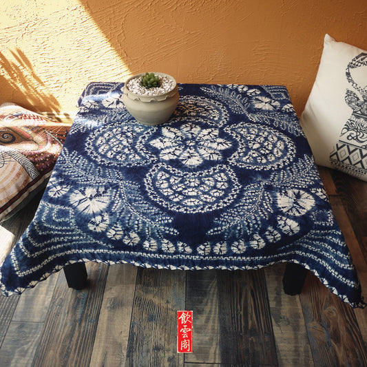 This is a tie-dyed tea mat table cloth