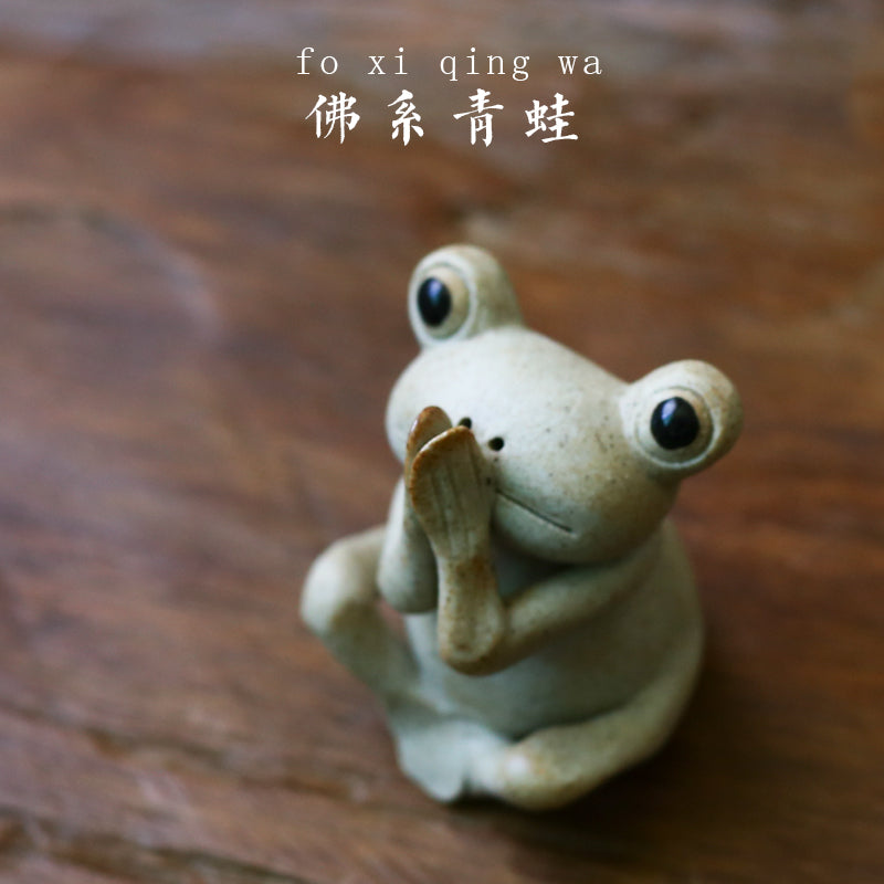 This is a pottery frog teapet