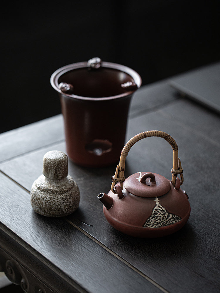 This is a pottery lifting handle kettle 