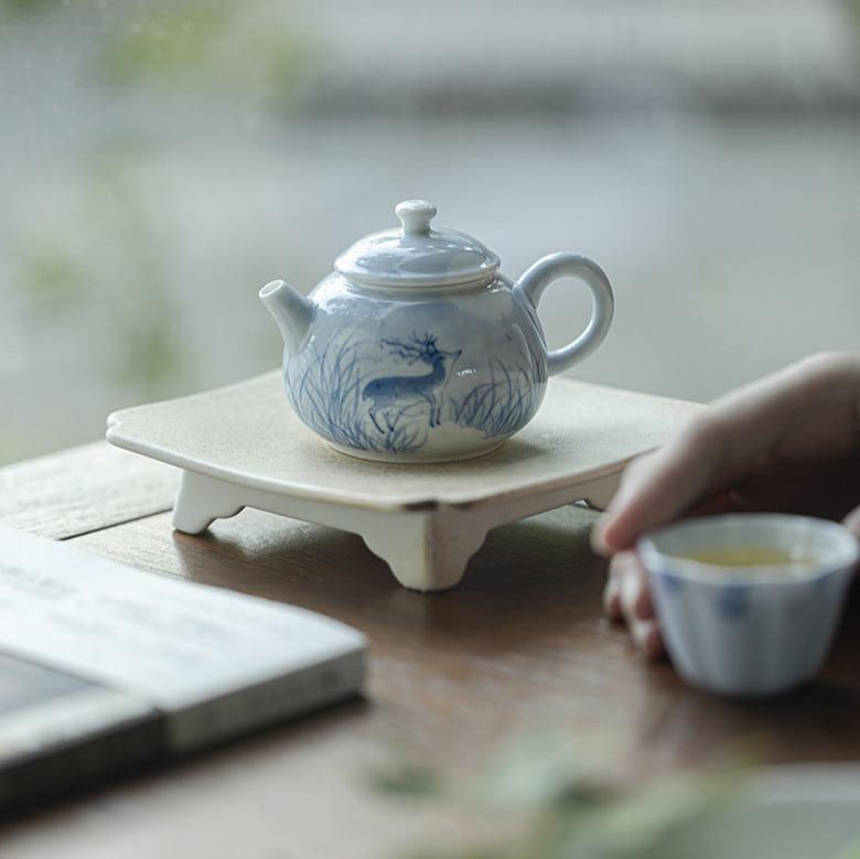 this is a ceramic teapot. this is a blue teapot