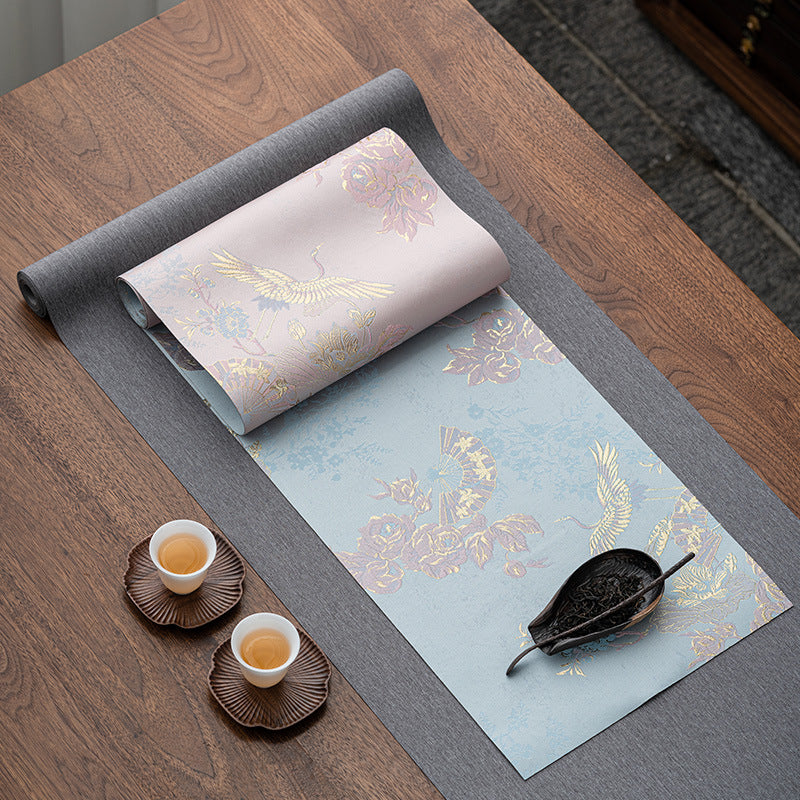 This is a silk brocade tea mat.this is a waterproof table cloth