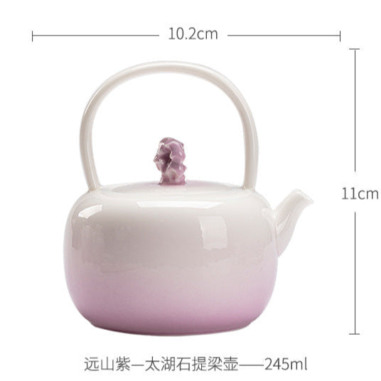 this is a ceramic purple teapot