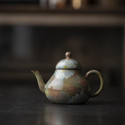 This is a ceramic teapot.this is an iced crackled teapot