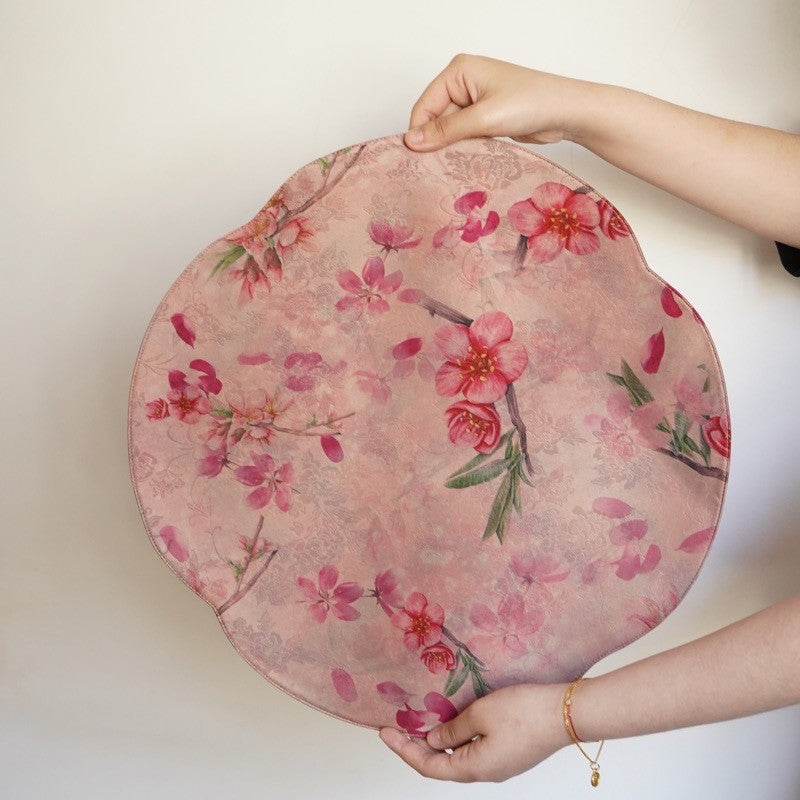 This is a silk brocade tea mat.this is a waterproof table cloth