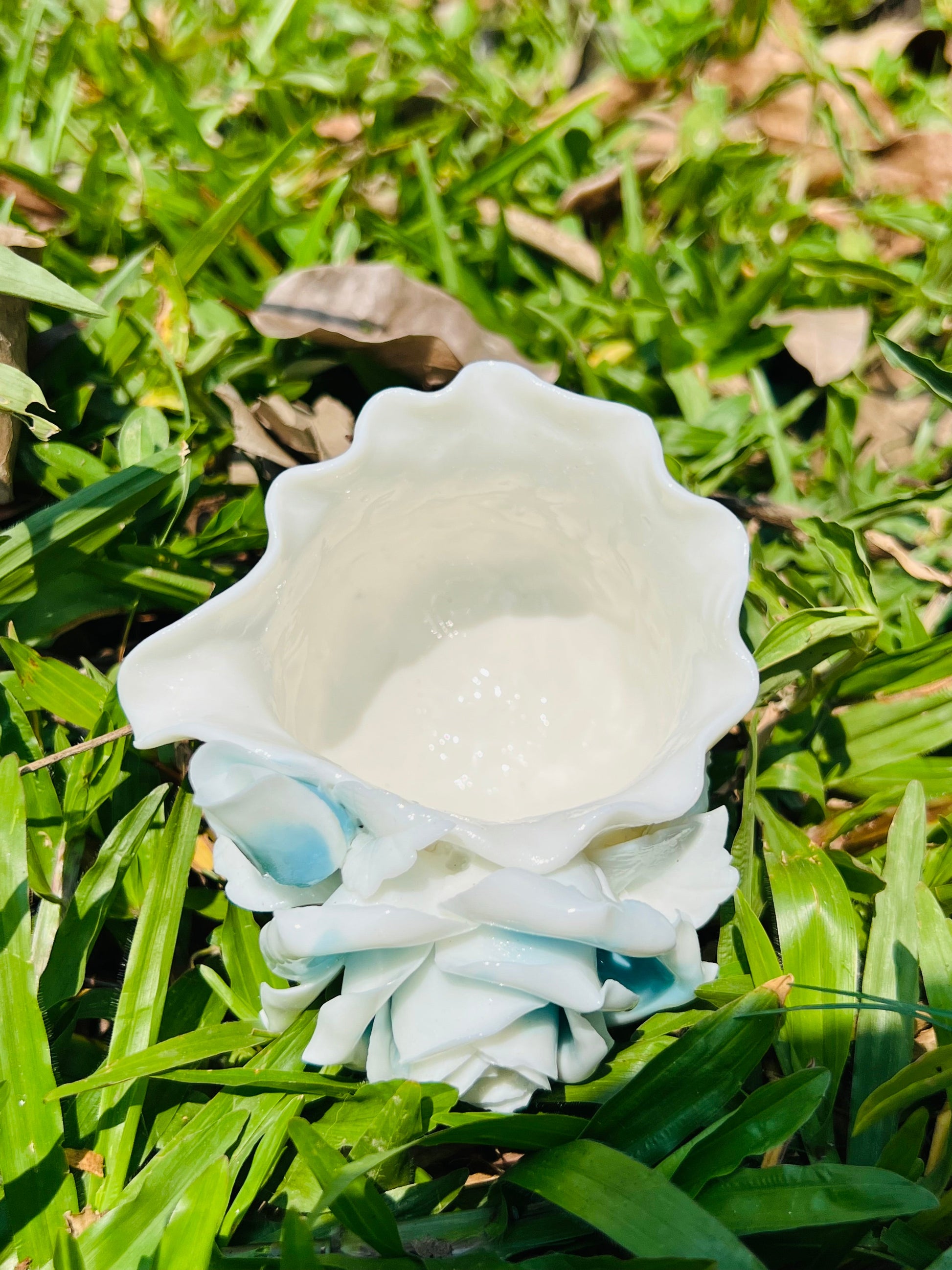 this is a woodfired white fine pottery flower teacup