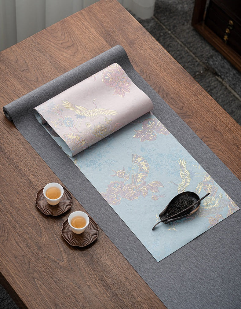 This is a silk brocade tea mat.this is a waterproof table cloth