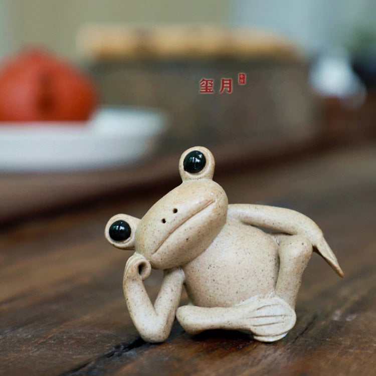 This is a pottery frog teapet