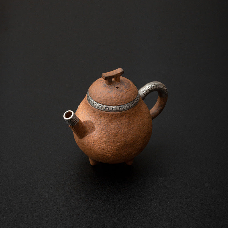 this is a pottery teapot. this is a pear teapot