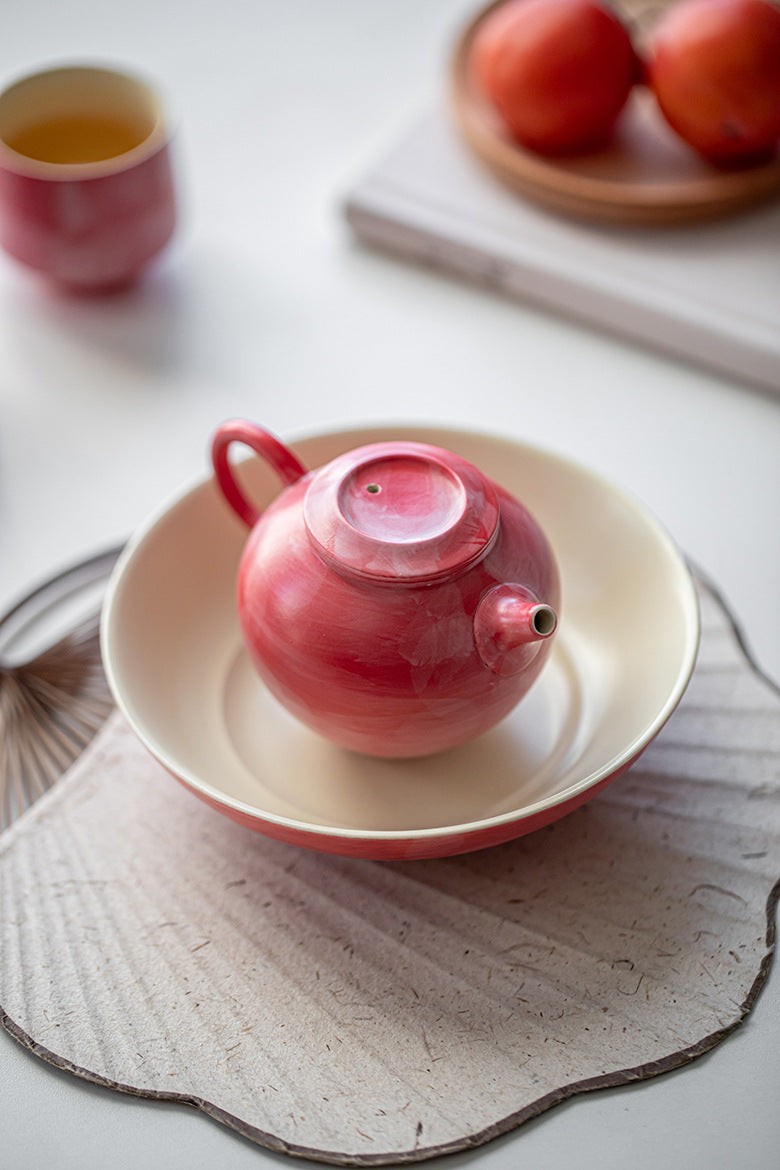 This is a ceramic teapot