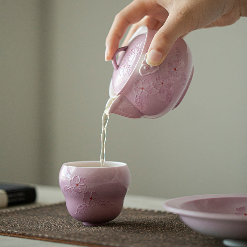 This is a Arita ware teapot. this is a pink ceramic teapot