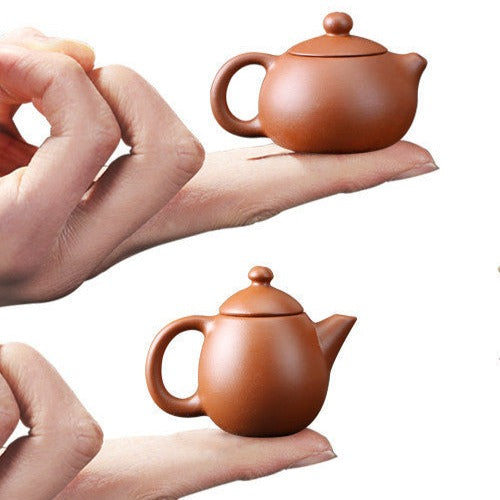 this is a mini zhuni red clay teapot