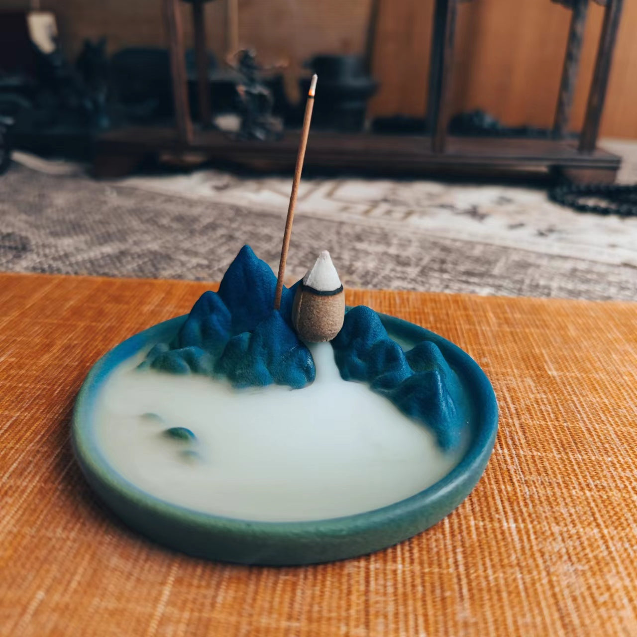 This is a pottery backflow incense holder