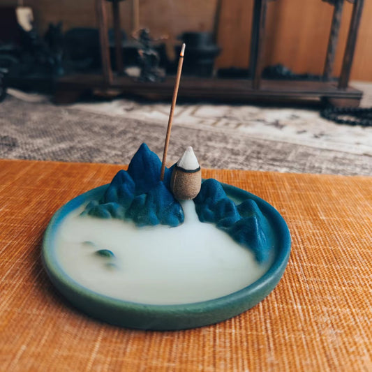 This is a pottery backflow incense holder