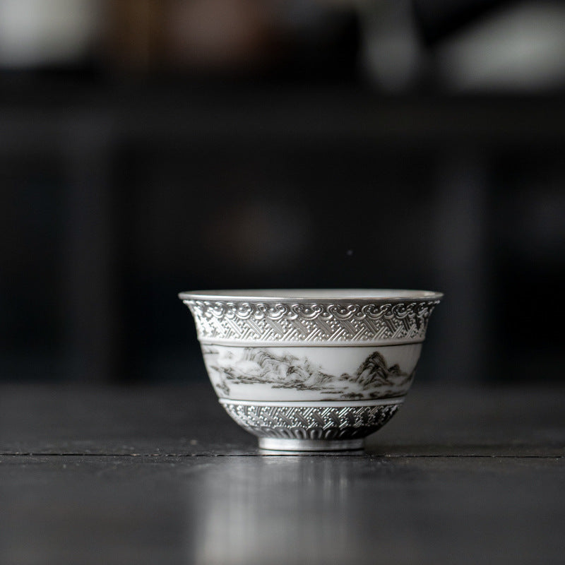 This is a gilted silver ceramic teacup