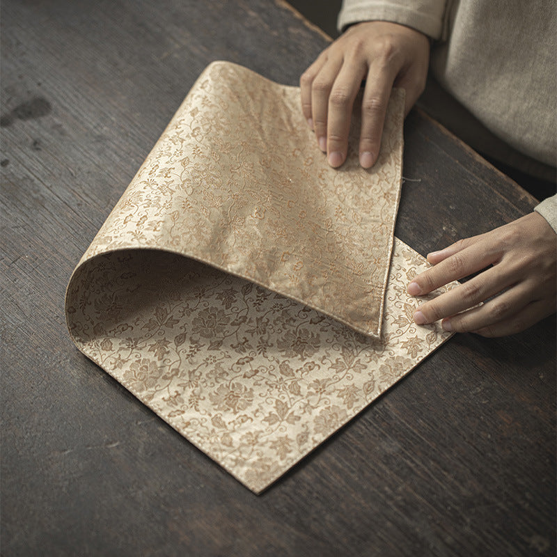 This is a silk brocade tea mat.this is a waterproof table cloth