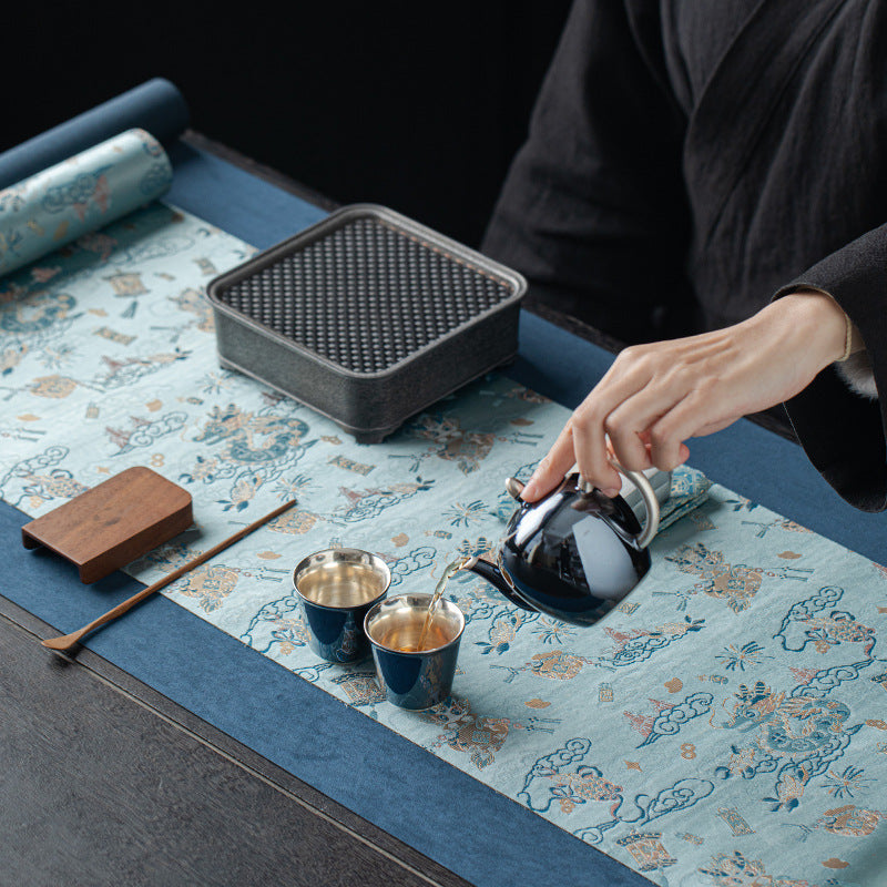 This is a silk brocade tea mat.this is a waterproof table cloth