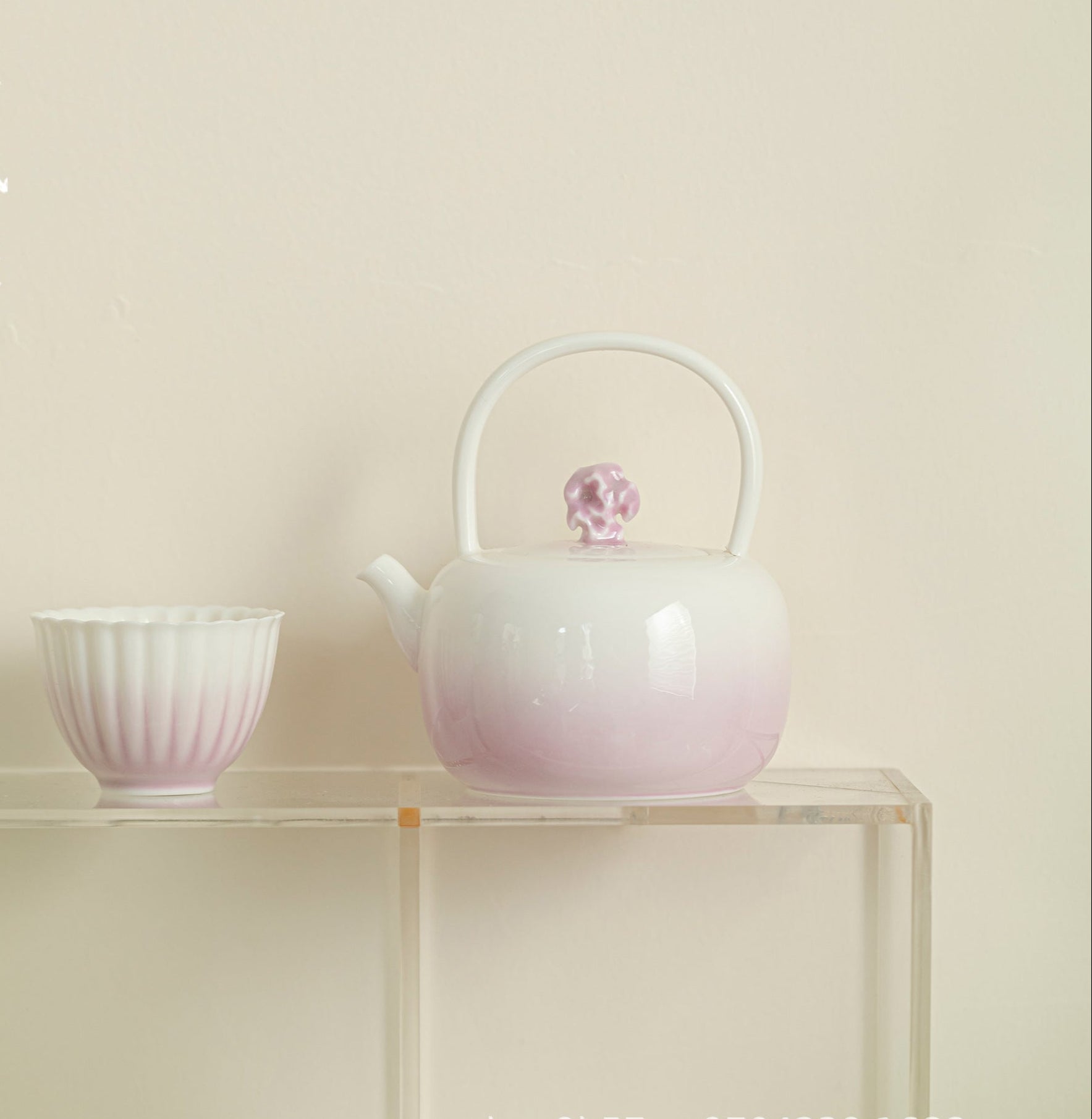 this is a ceramic purple teapot