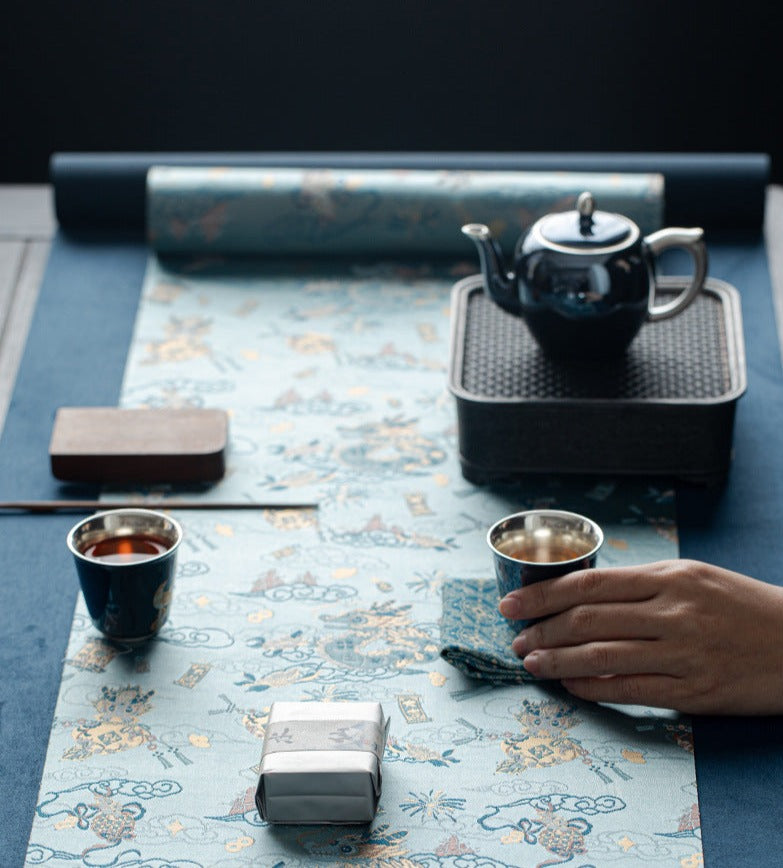 This is a silk brocade tea mat.this is a waterproof table cloth