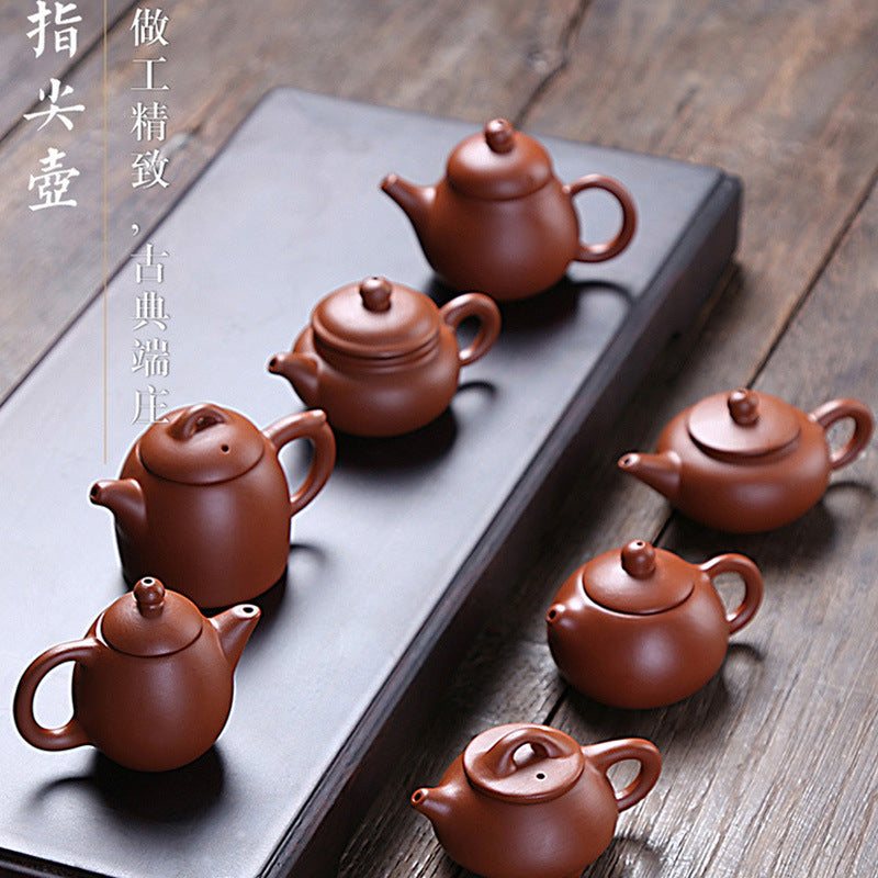 this is a mini zhuni red clay teapot