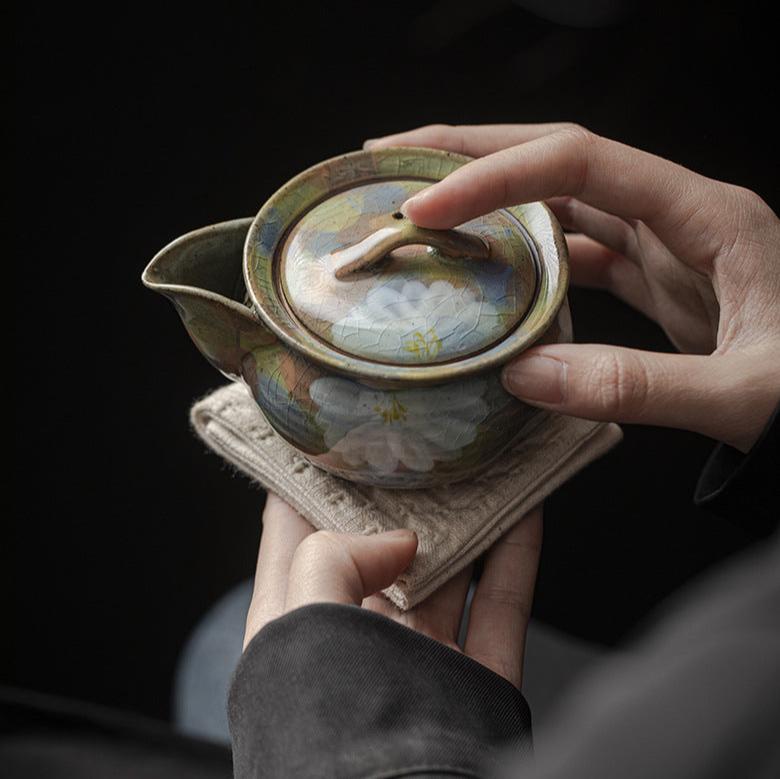 This is a ceramic teapot.this is an iced crackled baoping