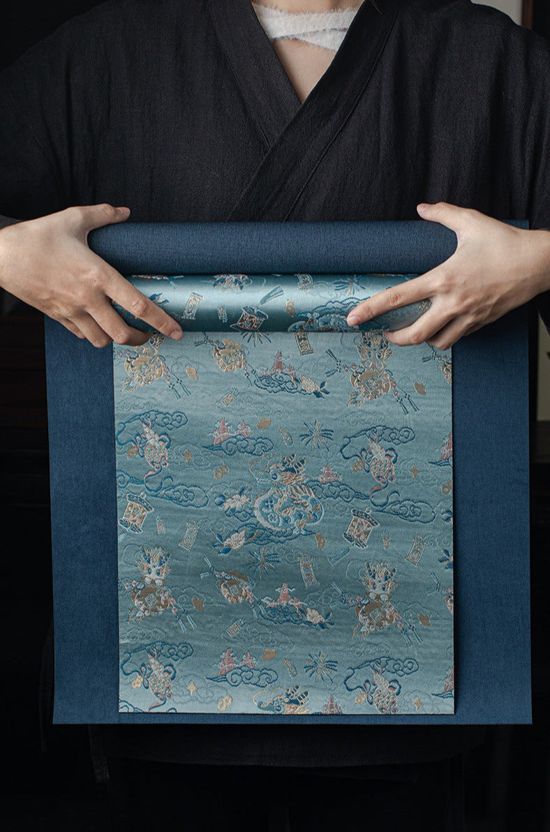 This is a silk brocade tea mat.this is a waterproof table cloth