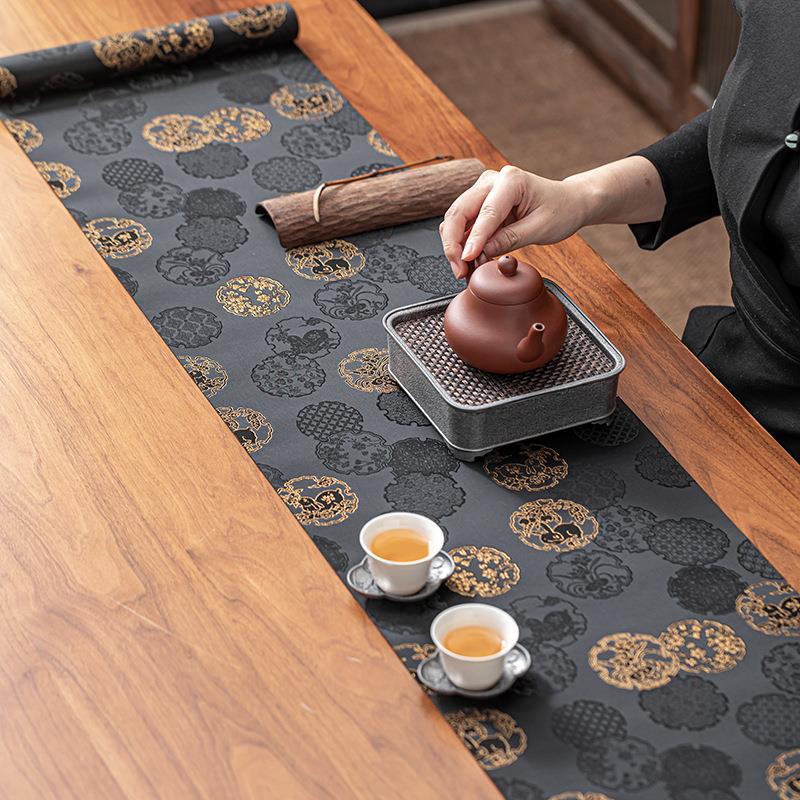 This is a silk brocade tea mat.this is a waterproof table cloth