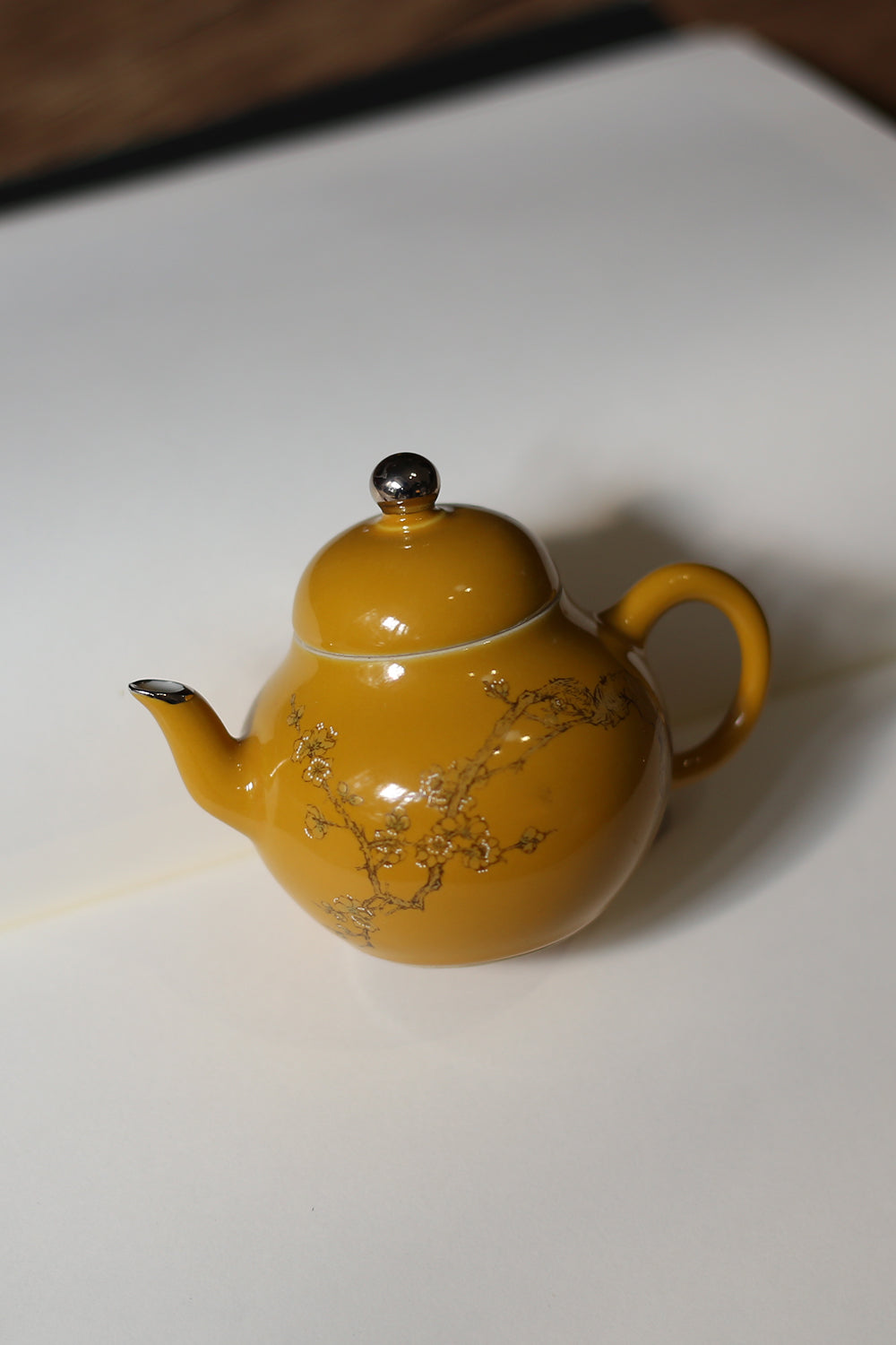 This is a ceramic teapot