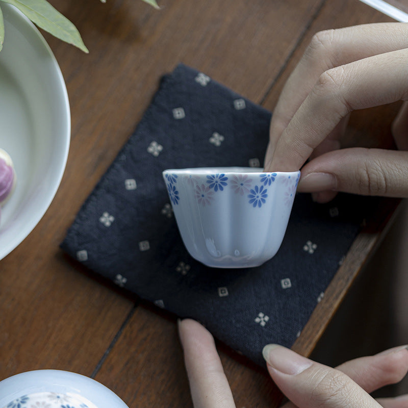 this is a ceramic teacup. this is a blue teacup