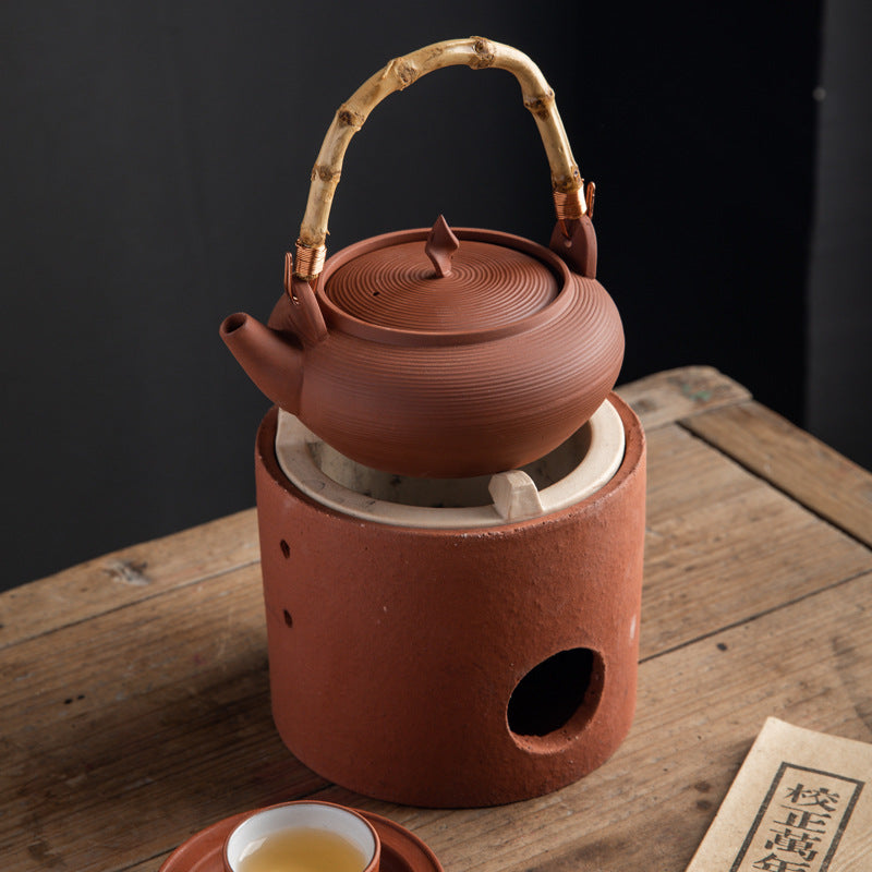 This is a pottery side handle kettle