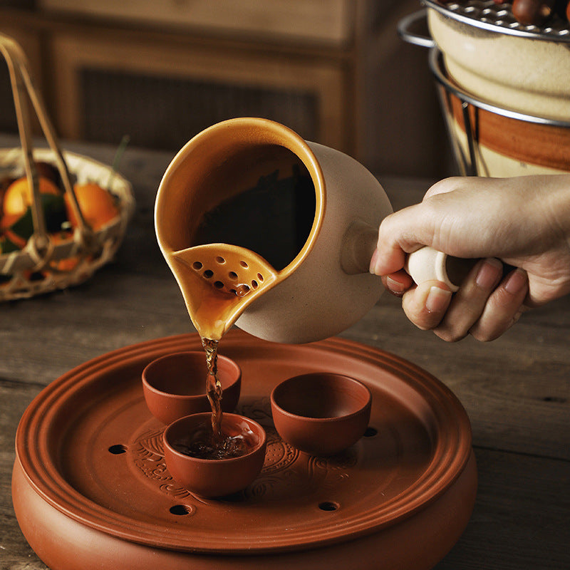 This is a pottery side handle kettle