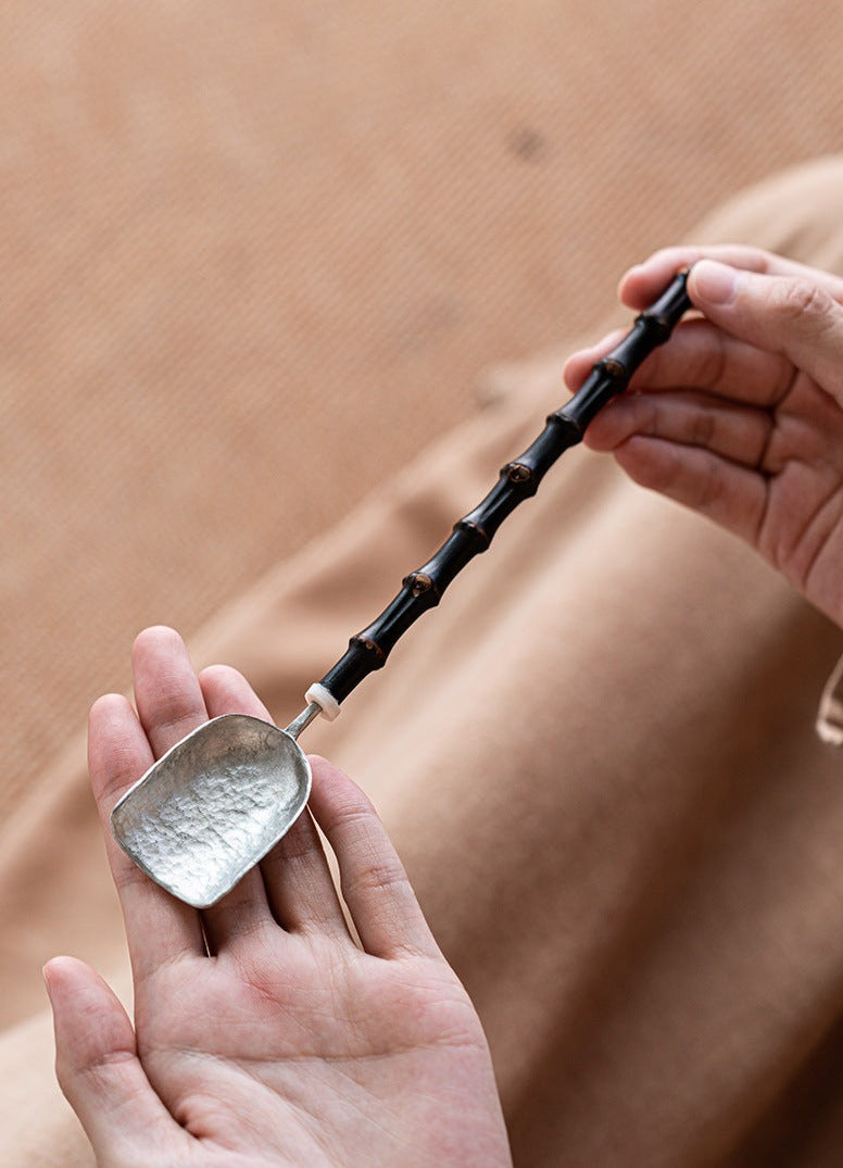 This is a tin tea scoop tea spoon