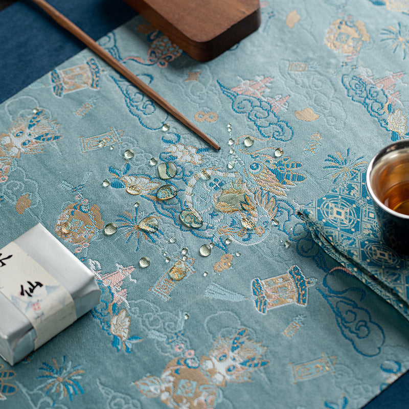 This is a silk brocade tea mat.this is a waterproof table cloth