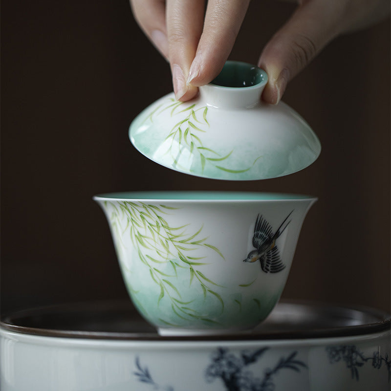 this is a ceramic teapot. this is a green gaiwan