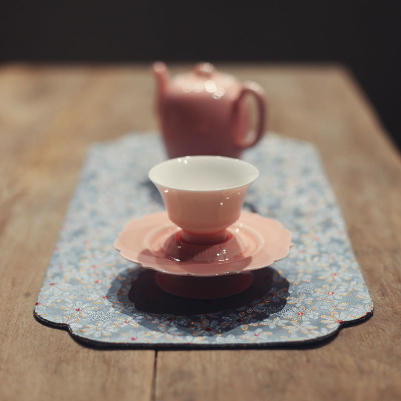 this is a pink ceramic teapot