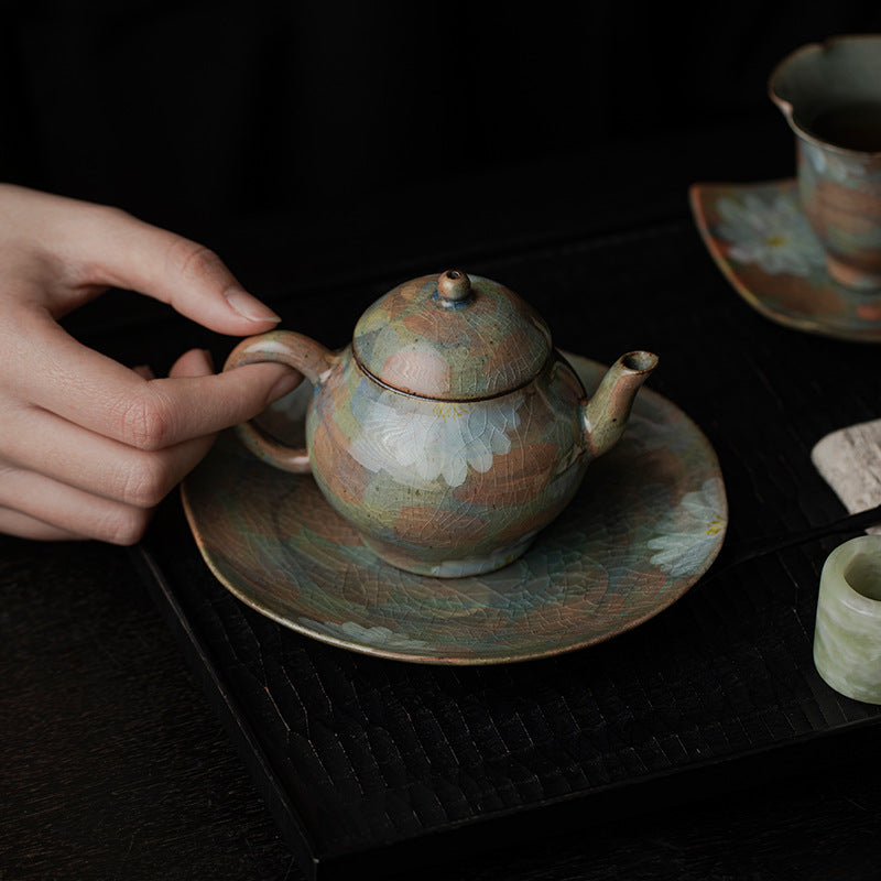 This is a ceramic teapot.this is an iced crackled teapot